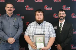 A John Deere Tech graduate being recognized during the annual graduation ceremony.