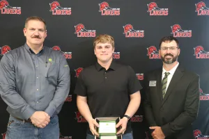 A John Deere Tech graduate being recognized during the annual graduation ceremony.