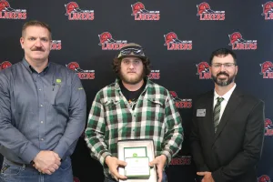 A John Deere Tech graduate being recognized during the annual graduation ceremony.
