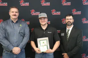 A John Deere Tech graduate being recognized during the annual graduation ceremony.