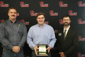 A John Deere Tech graduate being recognized during the annual graduation ceremony.