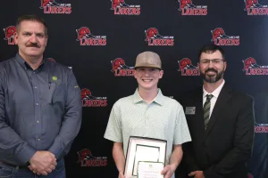 A John Deere Tech graduate being recognized during the annual graduation ceremony.