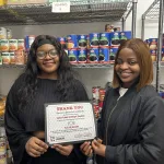 Lake Land College students celebrating the accomplishments of the Laker Food Pantry.