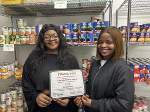 Lake Land College students celebrating the accomplishments of the Laker Food Pantry.