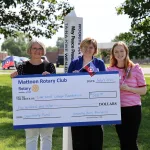 Mattoon Rotary Peacebuilder Committee Chair Tina Stovall presenting a $500 check to Lake Land College representatives.