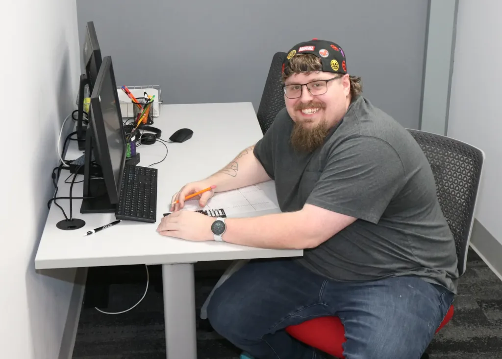 A photograph of a student taking a test in the student success center.