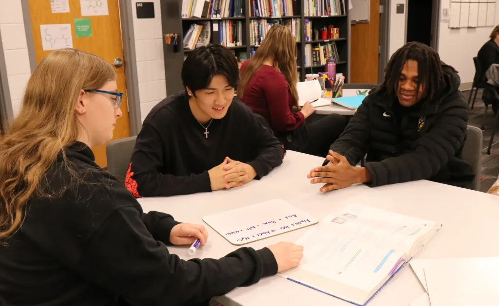 A photograph of students working on homework in the student success center.