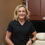 A Lake Land College dental hygiene alumna at the private dental practice she now owns.