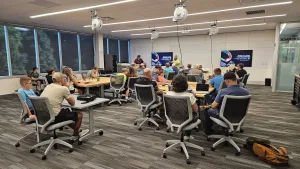A large group of community members attending a free, interactive 3D printing workshop in the Innovation Center lab at the Effingham Technology Center.