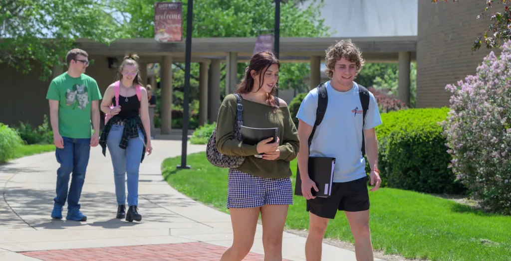 A photograph of students walking on campus.