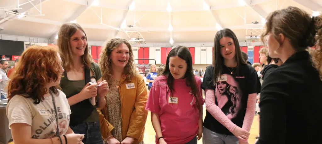 A photograph of middle school students at career fair.