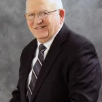 A headshot of Lake Land College alumnus and former trustee Mike Sullivan.